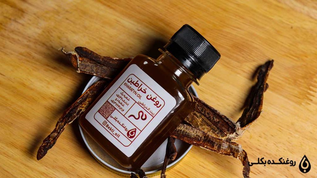 ظرف روغن خراطین روی میز
