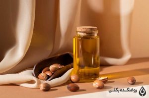 روغن آرگان در کنار دانه های آرگان