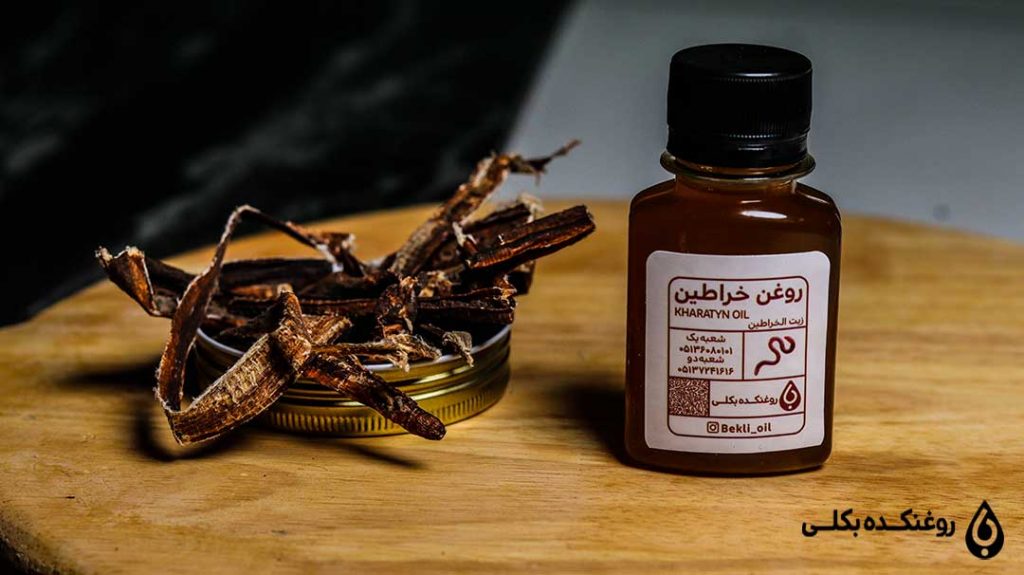 بطری روغن خراطین روی میز